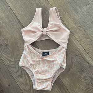 Something Navy baby swimsuit. Never worn. 9 months.